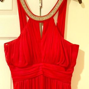 Elegant long red gown with embellished collar